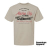 Beige T-shirt displayed on a plain background with a vintage-inspired graphic of a classic muscle car, mixed typography, and a soft red and black print design.